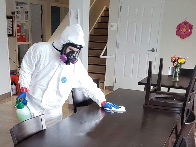 Wiping down surfaces with disinfectant